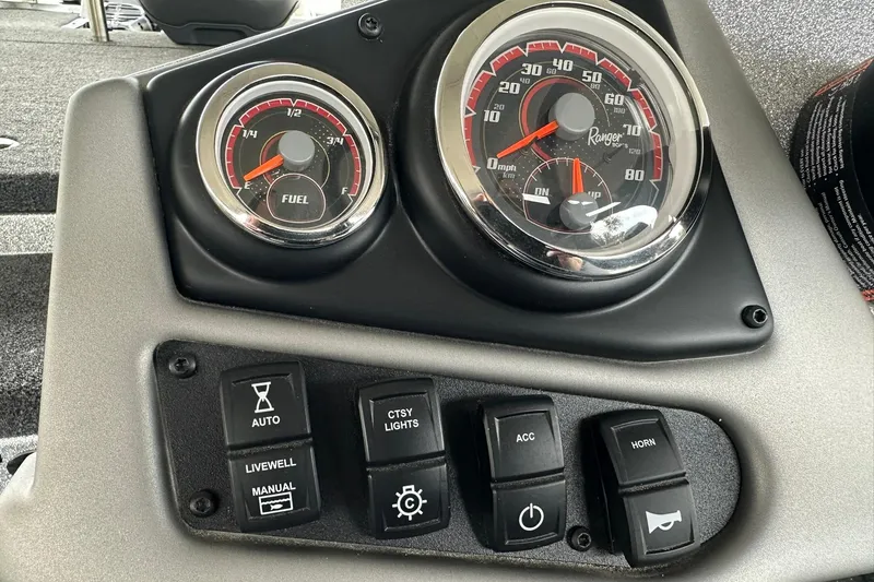 Slide: The Image of Dashboard of 2025 Ranger Z185 boat with gauges and control switches. - 116