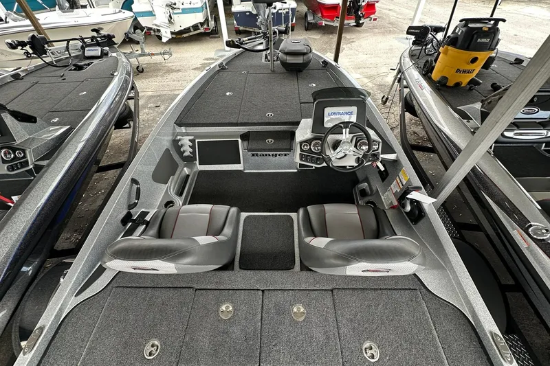 Slide: The Image of 2025 Ranger Z185 boat interior with steering wheel and seating, featuring modern navigation equipment. - 121