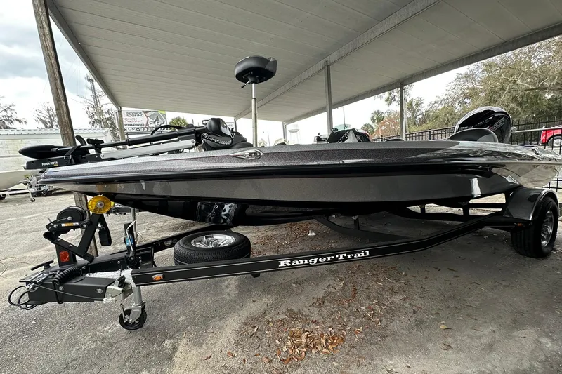 Slide: The Image of 2025 Ranger Z185 boat on trailer under canopy, showcasing sleek design and modern features. - 124