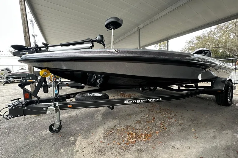 Slide: The Image of 2025 Ranger Z185 boat on trailer under shelter, showcasing sleek design and modern features. - 125