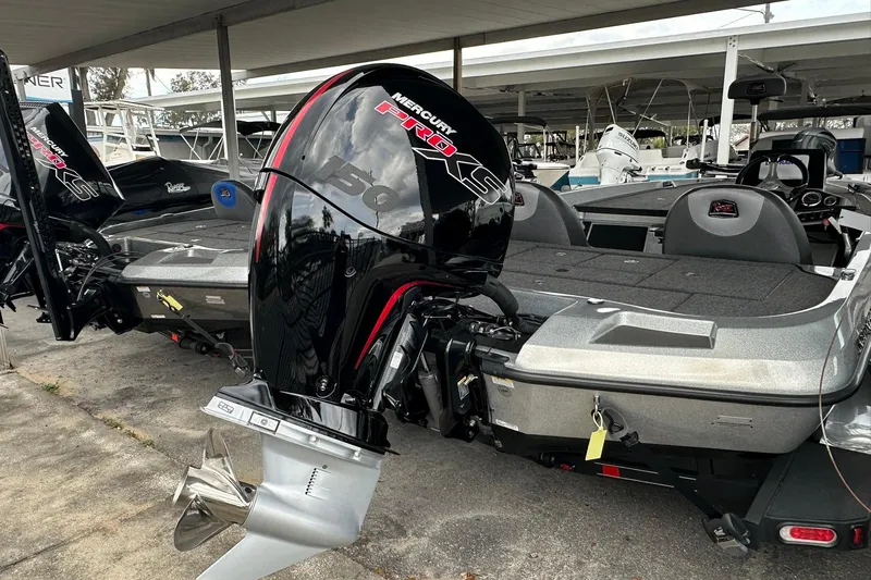 Slide: The Image of 2025 Ranger Z185 boat with Mercury Pro XS engine at a marina. - 127