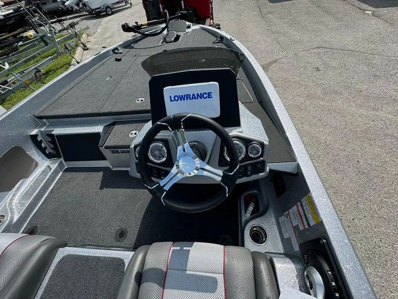Slide: The Image of 2025 Ranger Z185 boat cockpit with Lowrance display and steering wheel. - 3