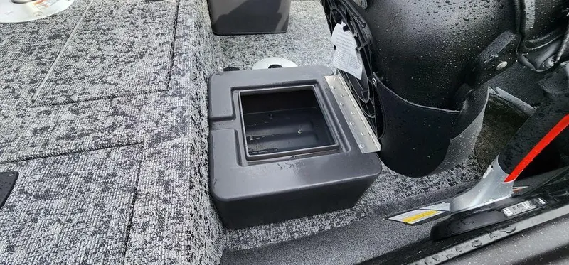 Slide: The Image of 2024 Tracker Pro Team 175 TF boat interior with storage compartment. - 11