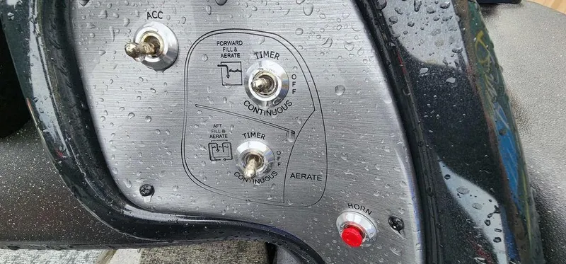 Slide: The Image of Control panel of 2024 Tracker Pro Team 175 TF boat with switches and buttons. - 13