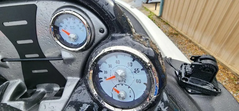 Slide: The Image of Dashboard of 2024 Tracker Pro Team 175 TF boat with speedometer and tachometer. - 14