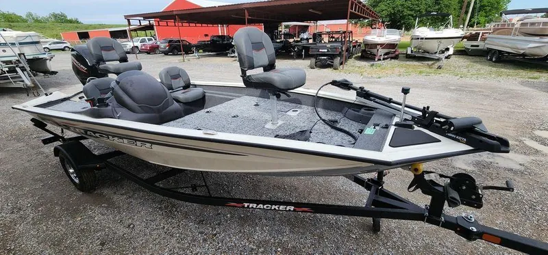 Slide: The Image of 2024 Tracker Pro Team 175 TF fishing boat on trailer, parked outdoors. - 18