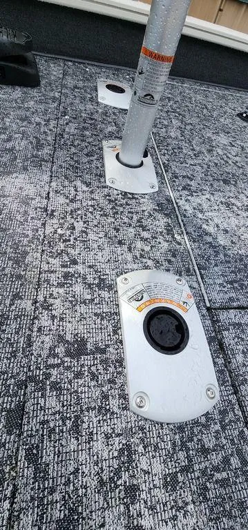 Slide: The Image of 2024 Tracker Pro Team 175 TF boat deck with seat mount and textured surface. - 20