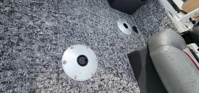 Slide: The Image of 2024 Tracker Pro Team 175 TF boat interior with textured flooring and seating. - 24