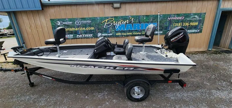 Slide: The Image of 2024 Tracker Pro Team 175 TF fishing boat on trailer, parked outside Bryan's Marine. - 25
