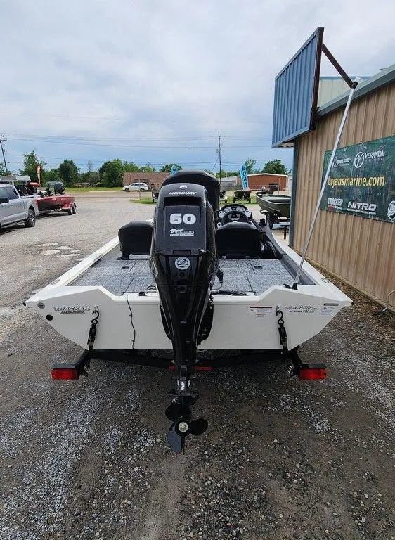 Slide: The Image of 2024 Tracker Pro Team 175 TF boat, rear view, parked outdoors. - 5