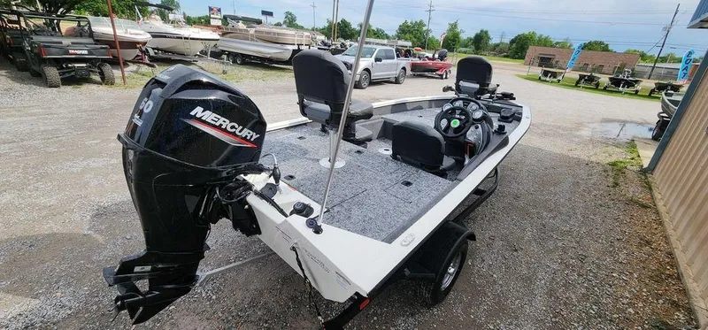 Slide: The Image of 2024 Tracker Pro Team 175 TF boat with Mercury engine, parked outdoors. - 6