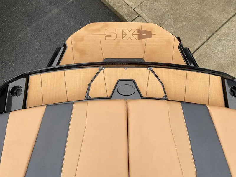 Slide: The Image of 2025 Axis A225 boat interior with tan and black seating design. - 17