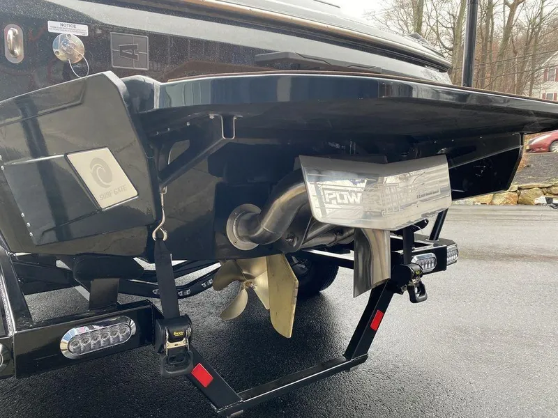 Slide: The Image of Rear view of 2025 Axis A225 boat showing propeller and exhaust system. - 5