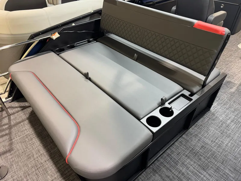 Slide: The Image of 2025 Godfrey Sweetwater 2286 SFLC boat seating with cup holders and modern design. - 11