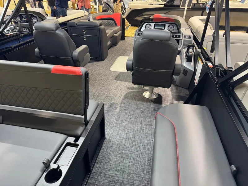Slide: The Image of 2025 Godfrey Sweetwater 2286 SFLC boat interior with modern seating and dashboard. - 12