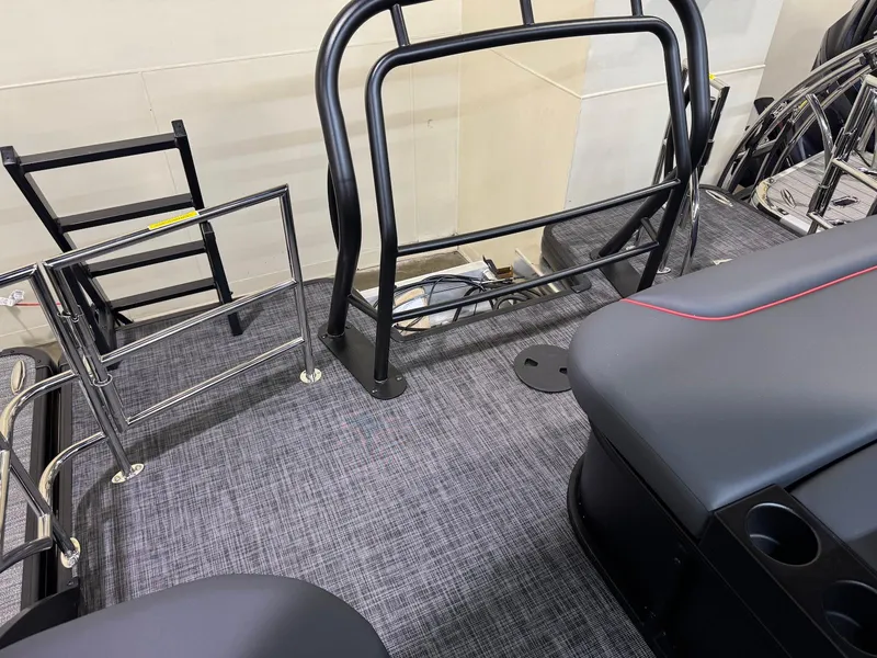 Slide: The Image of 2025 Godfrey Sweetwater 2286 SFLC boat interior with seating and railing details. - 13