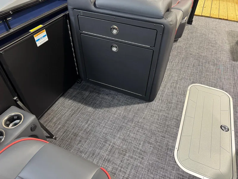 Slide: The Image of Interior of 2025 Godfrey Sweetwater 2286 SFLC boat with seating and storage compartments. - 14