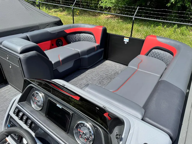 Slide: The Image of Interior of 2025 Godfrey Sweetwater 2286 SFLC pontoon boat with modern seating and dashboard. - 16