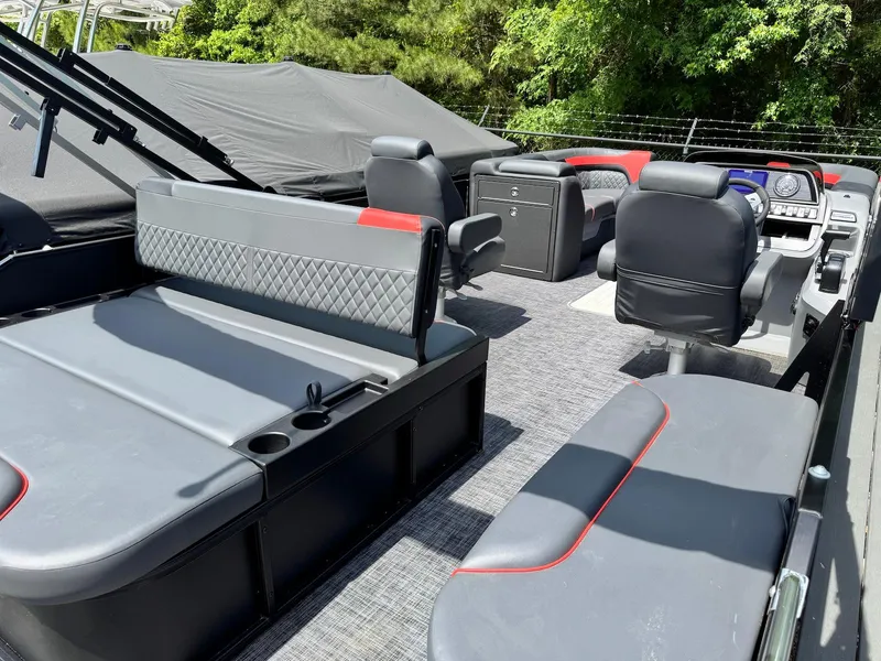 Slide: The Image of 2025 Godfrey Sweetwater 2286 SFLC pontoon boat interior with modern seating and dashboard. - 18