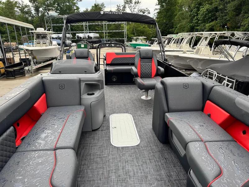 Slide: The Image of 2025 Godfrey Sweetwater 2286 SFLC pontoon boat with sleek gray and red seating. - 21
