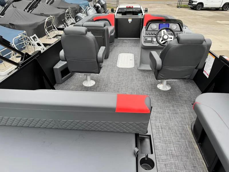 Slide: The Image of 2025 Godfrey Sweetwater 2286 SFLC boat interior with modern seating and control panel. - 26