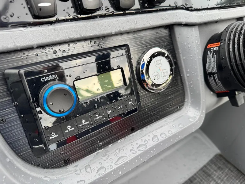 Slide: The Image of Control panel of 2025 Godfrey Sweetwater 2286 SFLC boat with Clarion audio system. - 30