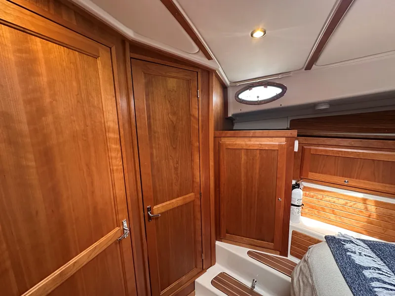 Slide: The Image of Main Cabin Port Side Storage and Door to Head - 19