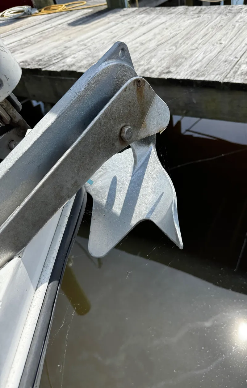 Slide: The Image of Anchor of 1990 Catalina 34 MK 1.5 sailboat near dock. - 20