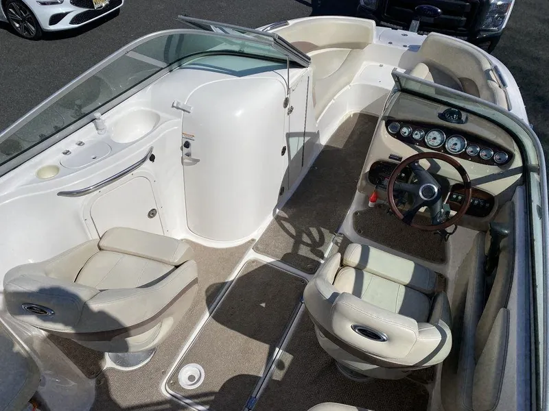Slide: The Image of 2005 Chaparral 216 Sunesta boat interior with seating and dashboard. - 10