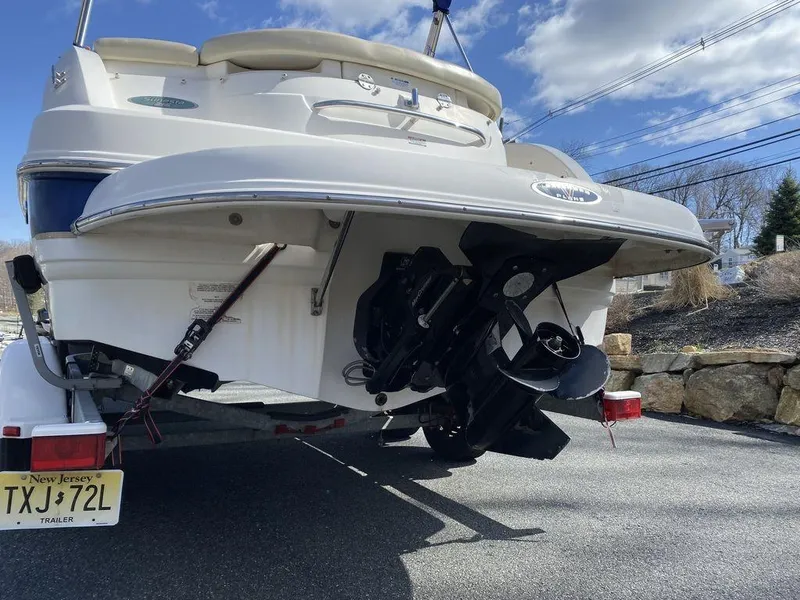 Slide: The Image of 2005 Chaparral 216 Sunesta boat on trailer, rear view with outboard motor. - 5