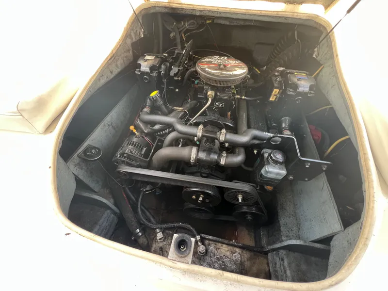 Slide: The Image of Engine compartment of a 2006 Bayliner 212 boat, showcasing detailed mechanical components. - 8