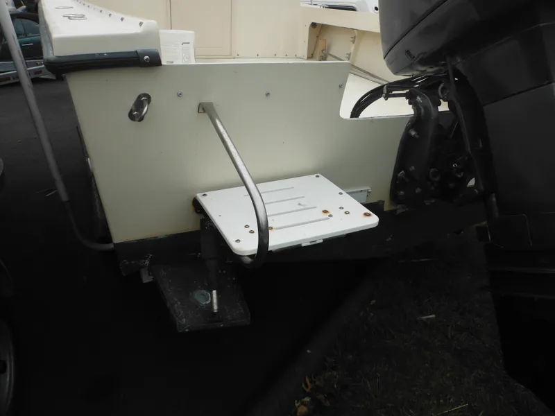 Slide: The Image of 2002 Parker 2520 Modified Vee Sport Cabin boat with outboard motor and swim platform. - 13