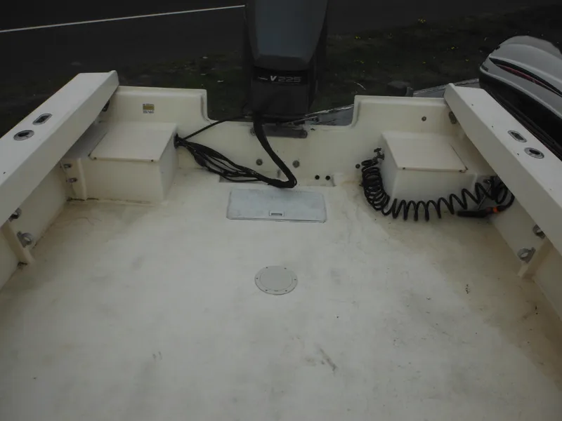 Slide: The Image of 2002 Parker 2520 Modified Vee Sport Cabin boat deck with storage compartments. - 15