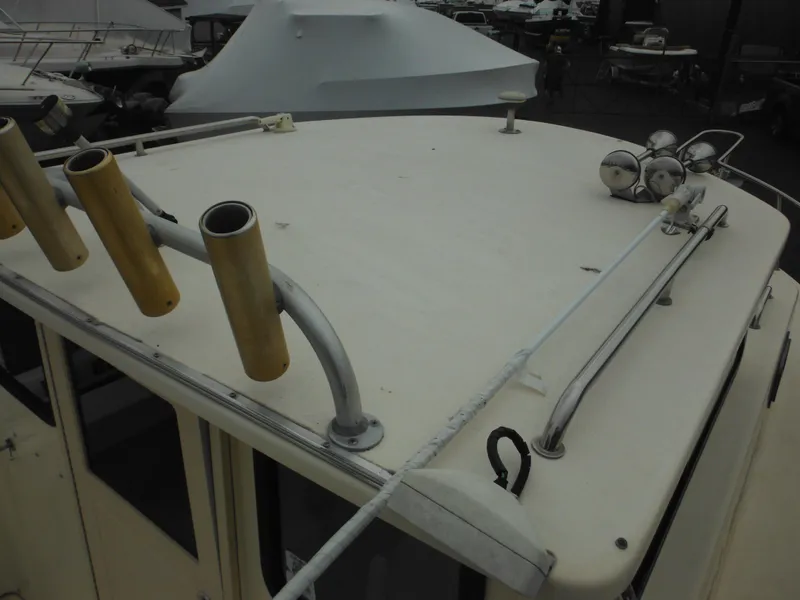 Slide: The Image of 2002 Parker 2520 Modified Vee Sport Cabin boat roof with rod holders and lights. - 22