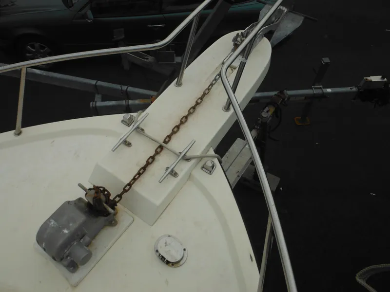 Slide: The Image of Bow of a 2002 Parker 2520 Modified Vee Sport Cabin with anchor chain and railing. - 23