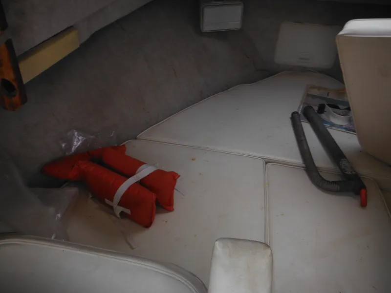 Slide: The Image of Interior of 2002 Parker 2520 Modified Vee Sport Cabin with life jackets and equipment. - 30