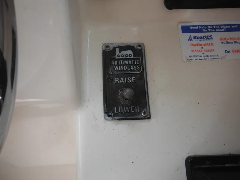 Slide: The Image of 2002 Parker 2520 windlass control panel with raise and lower options. - 34