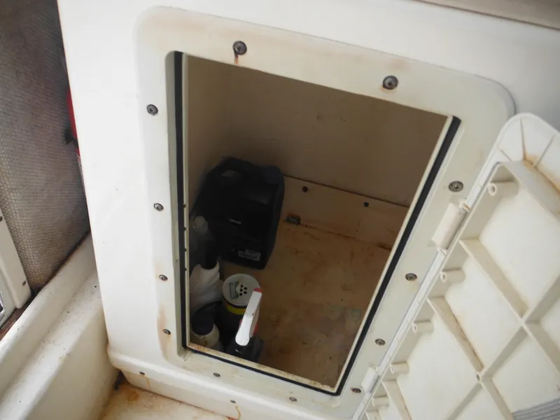 Slide: The Image of Open storage compartment in 2002 Parker 2520 Modified Vee Sport Cabin boat. - 39