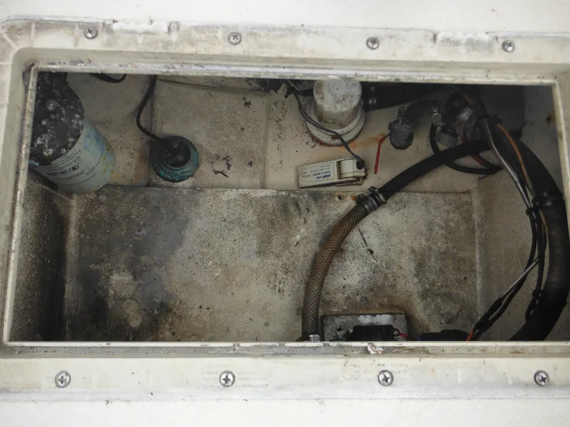 Slide: The Image of 2002 Parker 2520 Modified Vee Sport Cabin engine compartment with wiring and components. - 46