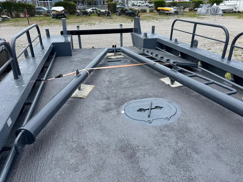 Slide: The Image of 2004 SeaArk 35 Aluminum Work Boat with A-Frame, docked, showcasing deck and equipment. - 8