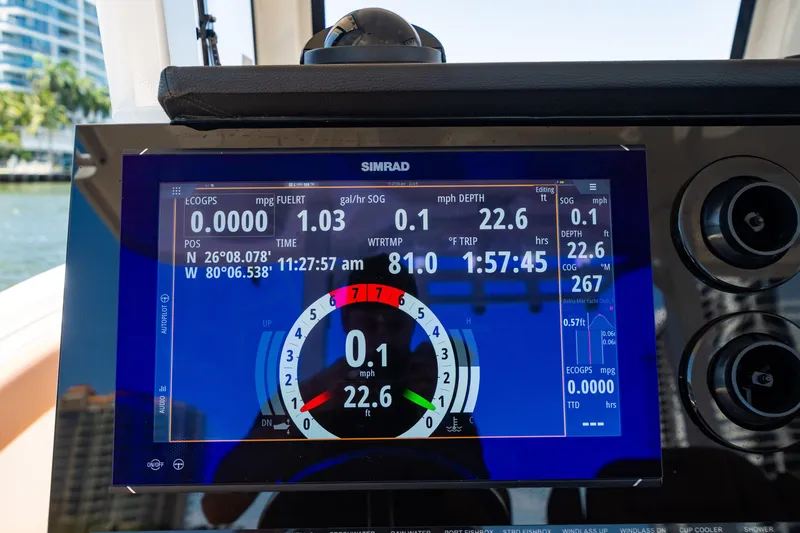 Slide: The Image of Simrad display on 2023 Sea Pro 320 DLX Offshore boat, showing navigation and performance data. - 21