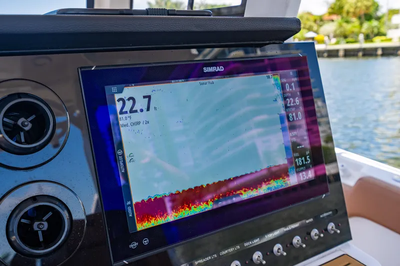 Slide: The Image of Simrad display on 2023 Sea Pro 320 DLX Offshore boat, showing sonar data. - 22