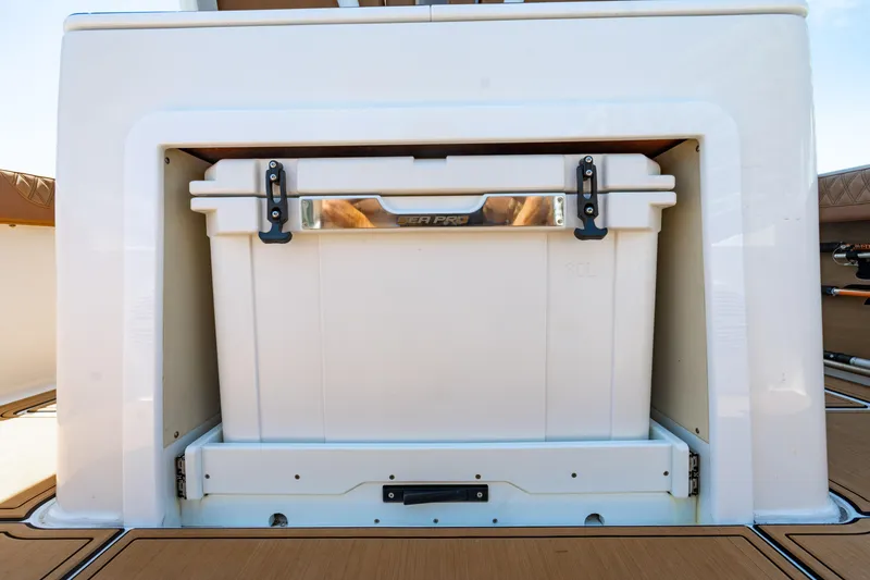 Slide: The Image of 2023 Sea Pro 320 DLX Offshore cooler storage compartment, showcasing sleek design and functionality. - 34