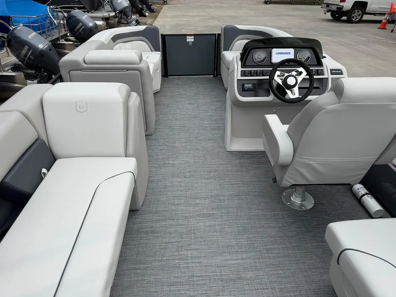 Slide: The Image of 2025 Godfrey Sweetwater 2086 SB pontoon boat interior with modern seating and steering console. - 11