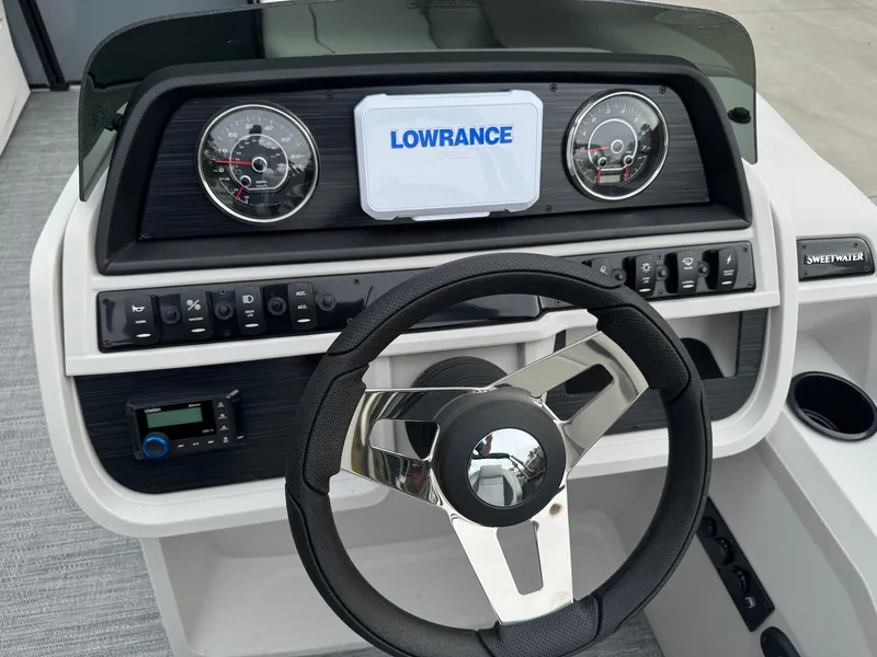 Slide: The Image of Dashboard of 2025 Godfrey Sweetwater 2086 SB with Lowrance display and steering wheel. - 15