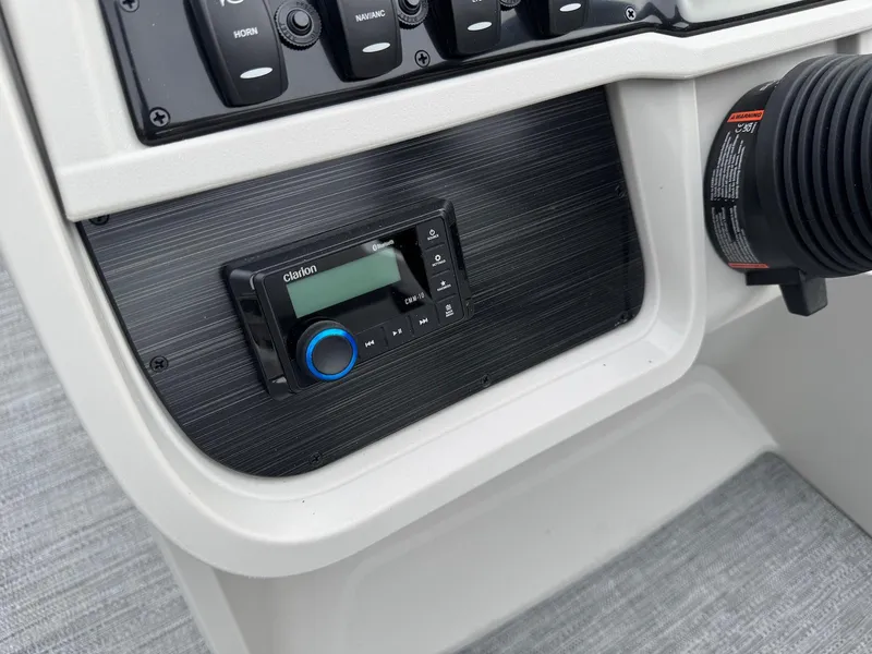 Slide: The Image of Control panel of 2025 Godfrey Sweetwater 2086 SB boat with Clarion audio system. - 17