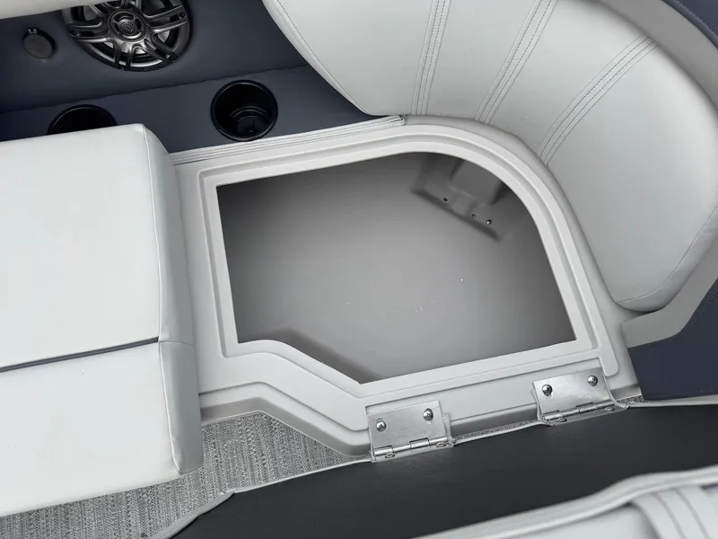 Slide: The Image of Interior view of 2025 Godfrey Sweetwater 2086 SB boat, featuring storage compartment and speaker. - 24