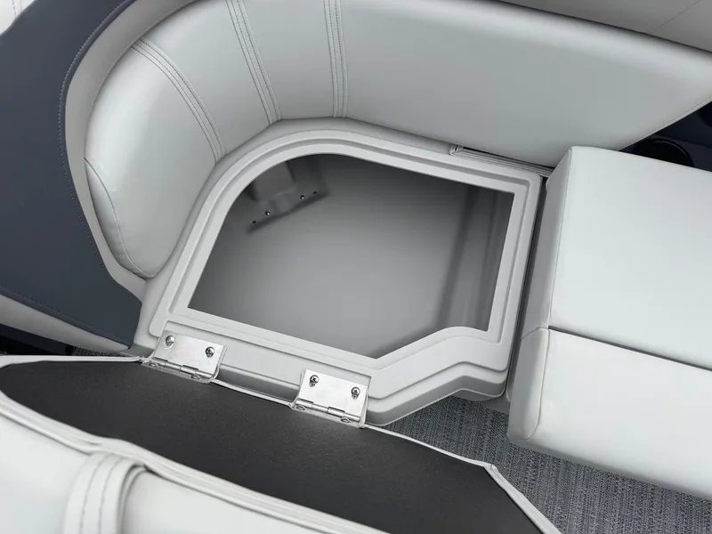 Slide: The Image of Storage compartment in 2025 Godfrey Sweetwater 2086 SB boat with open seat lid. - 26