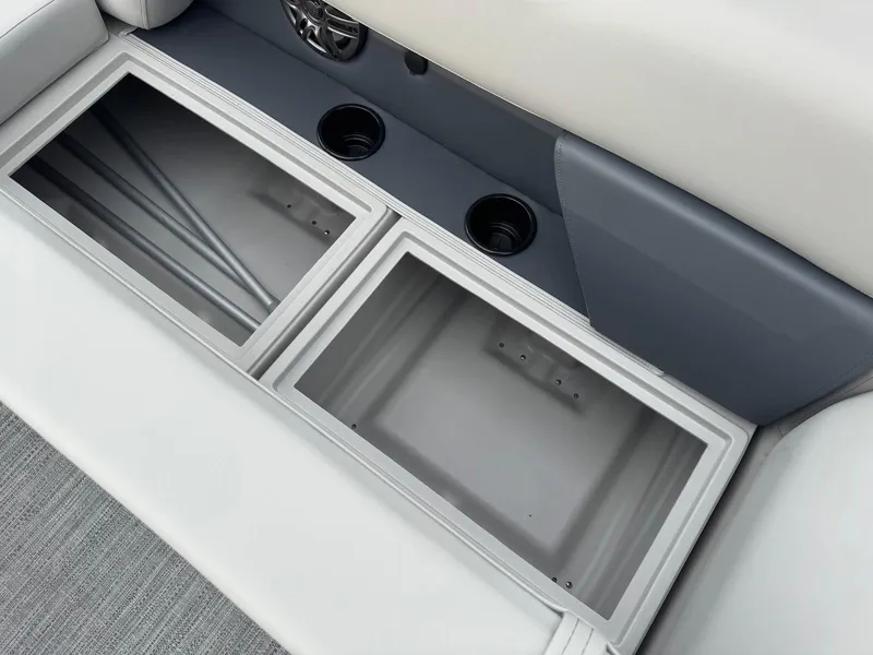 Slide: The Image of Interior storage compartments of 2025 Godfrey Sweetwater 2086 SB boat with cup holders. - 27