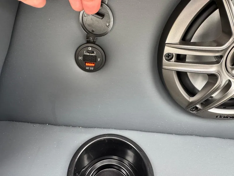 Slide: The Image of 2025 Godfrey Sweetwater 2086 SB boat interior with speaker and power outlet. - 29